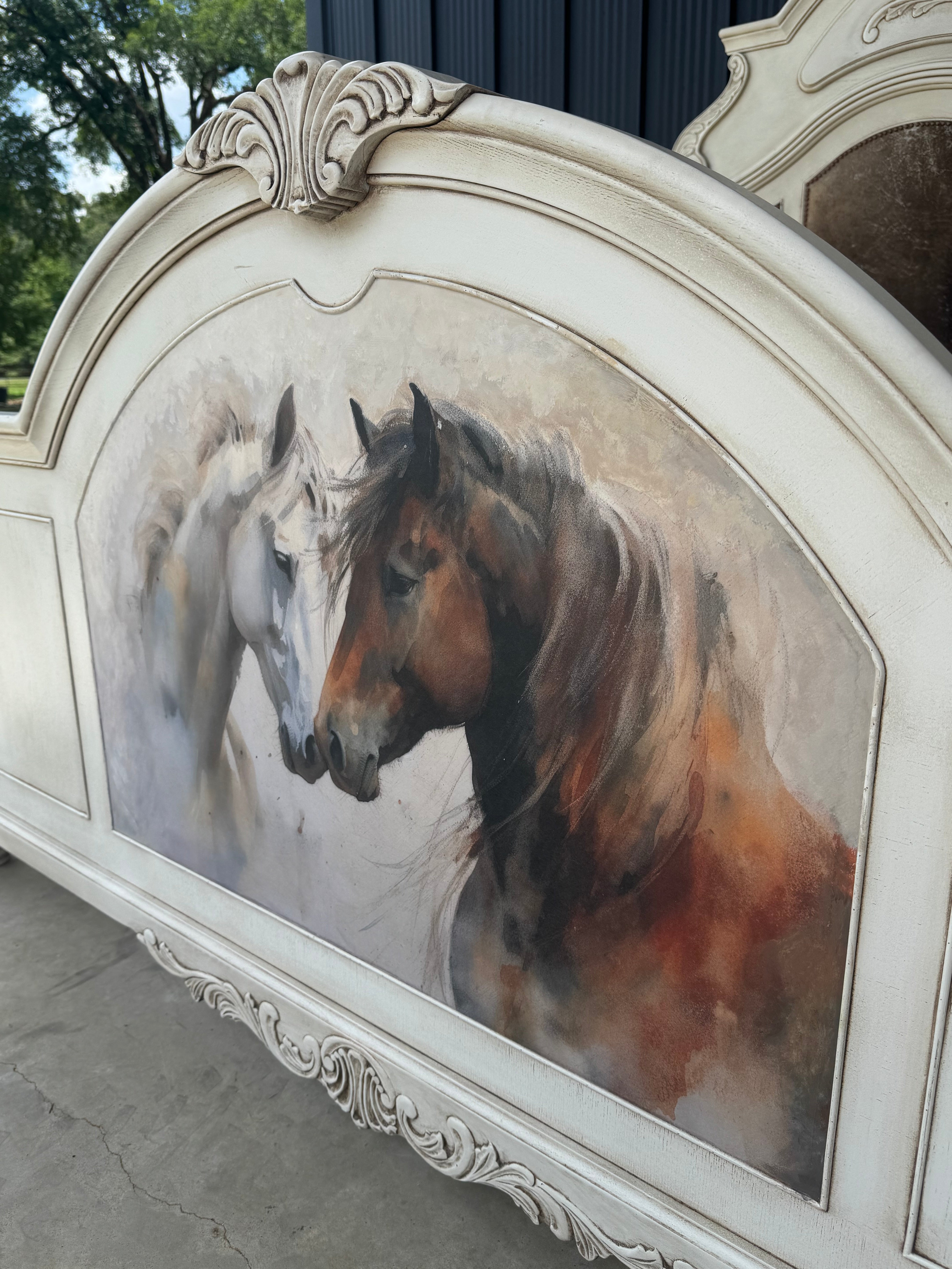 Decorative headboard with a decoupage print of two horses on a white background